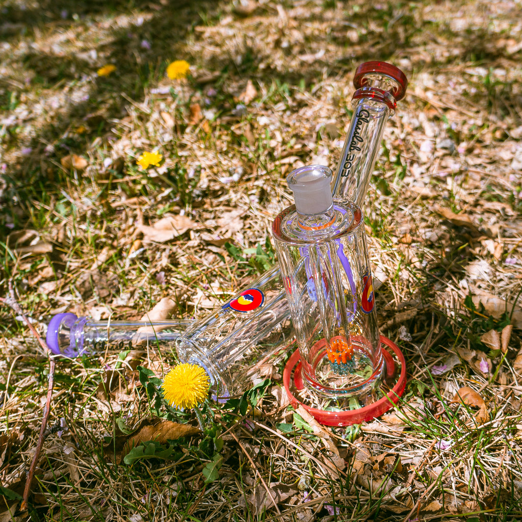 Borosilicate glass on grass with flowers