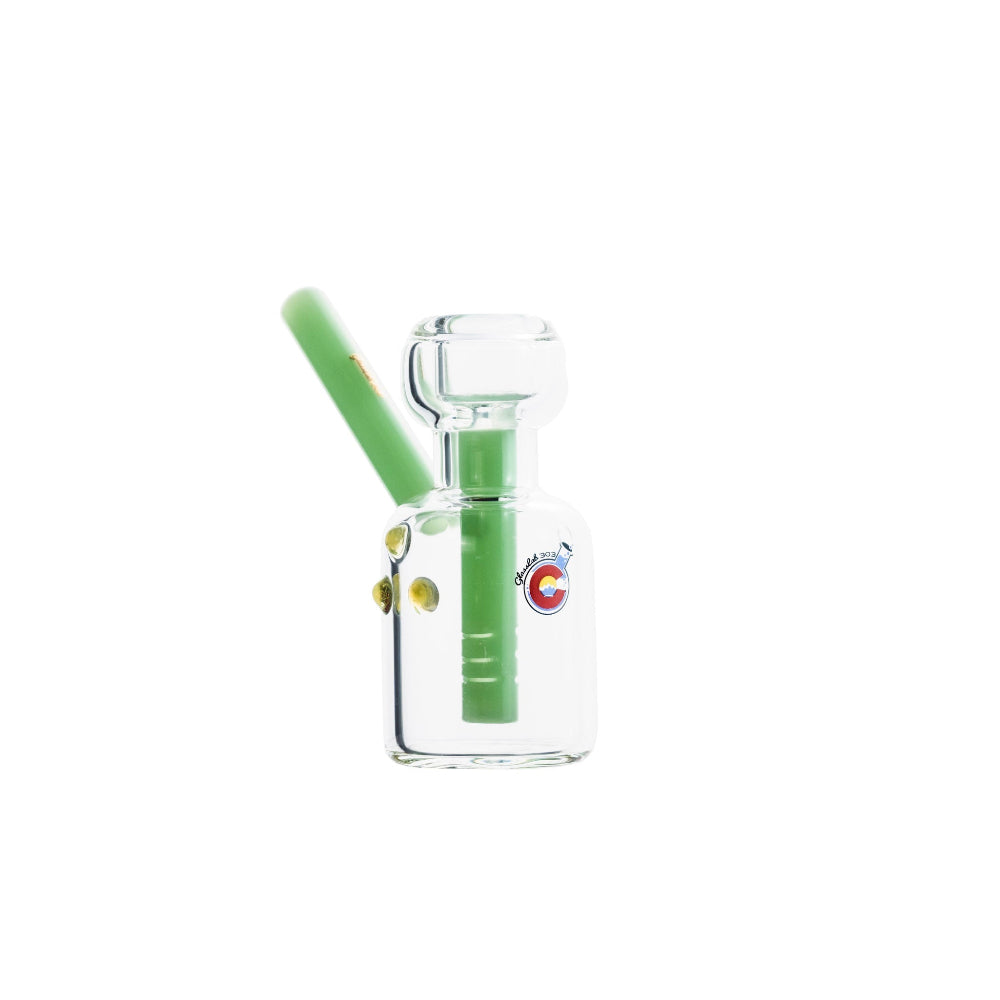 Clear glasslab303 cologne bottle with green straw and colorful label on a white background